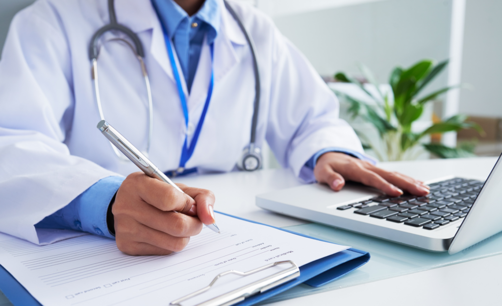 Doctor monitoring the patients and reviewing billing and reports in a health center y centro de salud